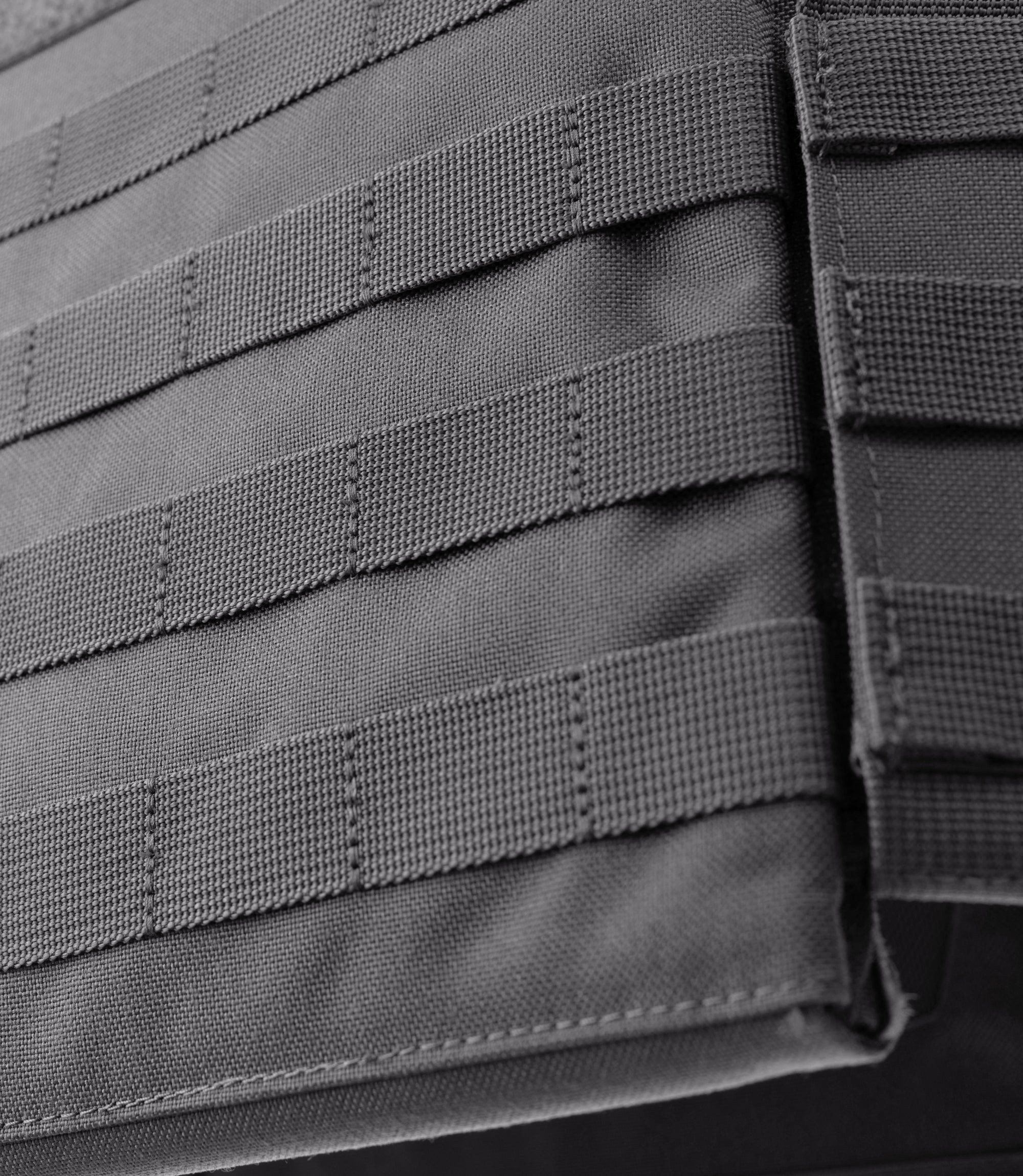 Closeup MOLLE view of Specialist Plate Rack in Wolf Grey |color_wolf grey
