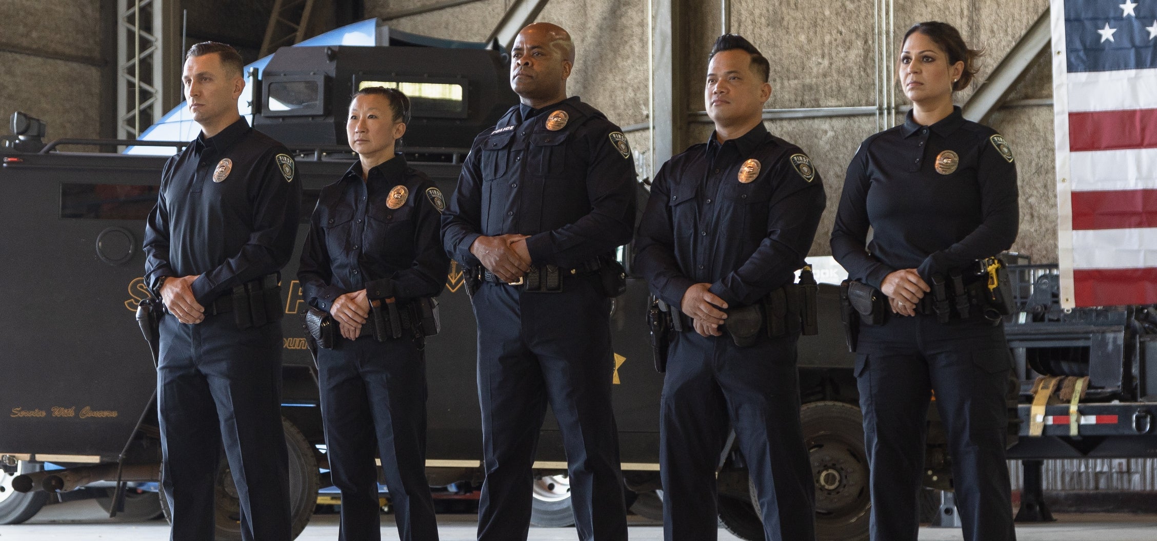 Image of officers in a line wearing our uniform apparel