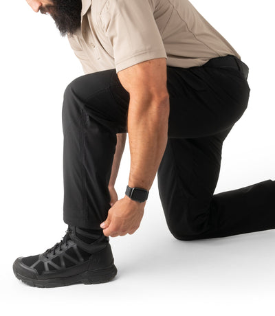 Man kneeling in Mens V2 Tactical Pants in Black
