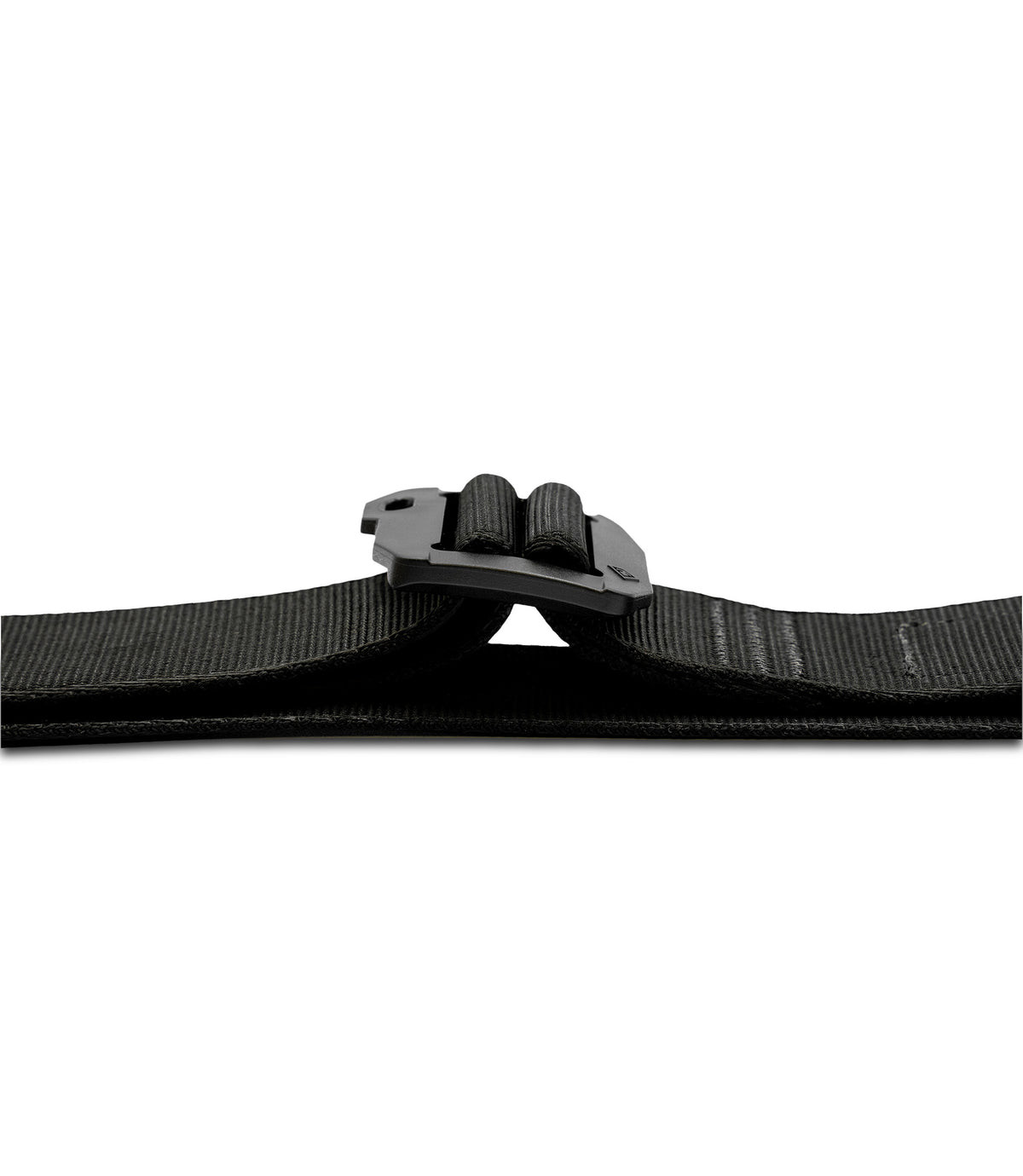 Close-up of a black webbed belt with a black plastic quick-release buckle lay flat on a plain white background |color_black